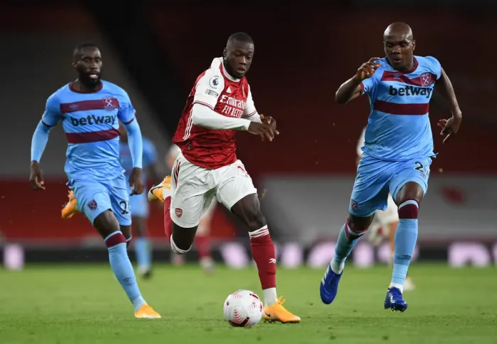 Framed Print : Pepe vs Ogbonna: Intense Face-Off in Arsenal's Battle Against West Ham Framed Print : Pepe vs Ogbonna: Intense Face-Off in Arsenal's Battle Against West Ham