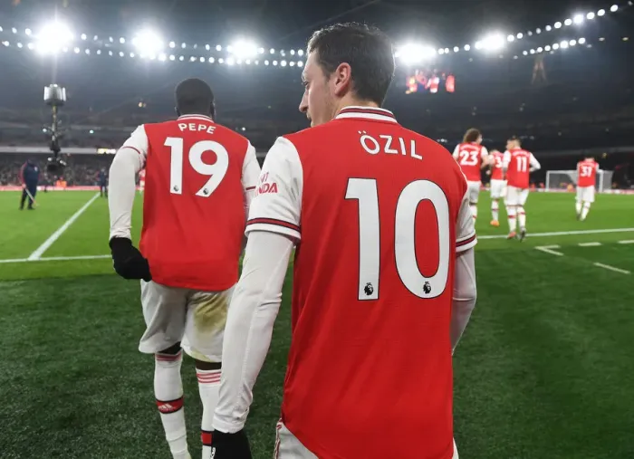 Framed Print : Pepe vs Ozil: A Star-Studded Showdown at Arsenal's Battle against Manchester United (2019-20)