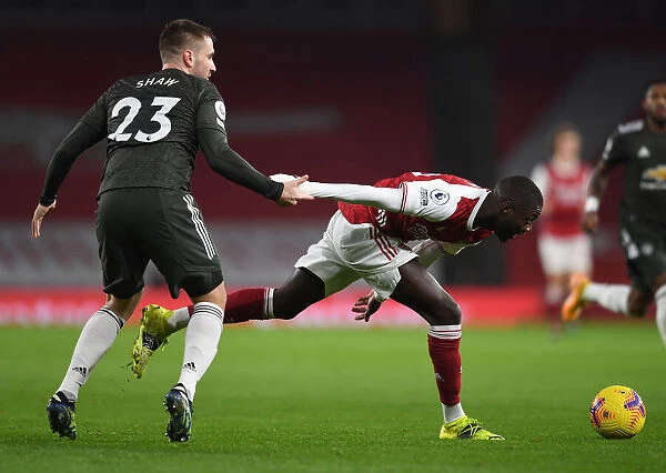 Pepe vs Shaw: Premier League Showdown at Empty Emirates Stadium - Arsenal vs Manchester United 2021