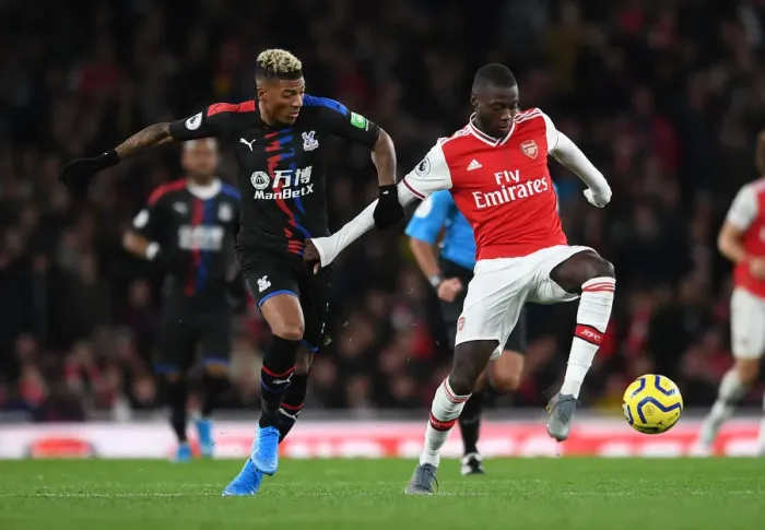 Framed Print : Pepe vs van Aanholt: A Premier League Showdown at Emirates Stadium