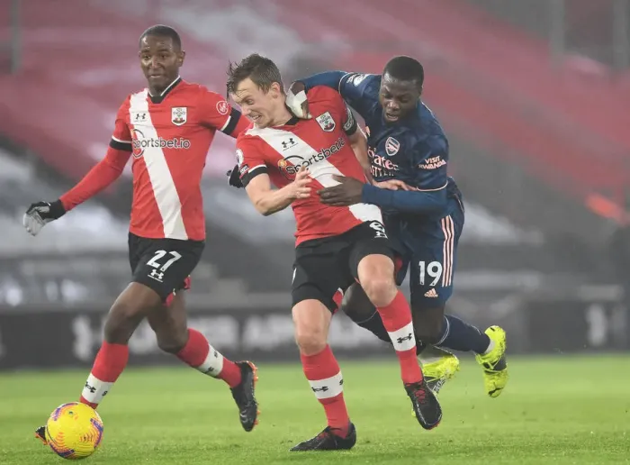Framed Print : Pepe vs Ward-Prowse: Clash in Empty St. Mary's Stadium - Southampton vs Arsenal, Premier League 2020-21