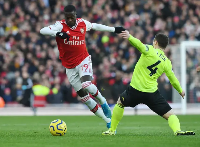 Framed Print : Pepe's Slick Moves: Outsmarting Fleck in Arsenal's Thrilling Premier League Victory Framed Print : Pepe's Slick Moves: Outsmarting Fleck in Arsenal's Thrilling Premier League Victory