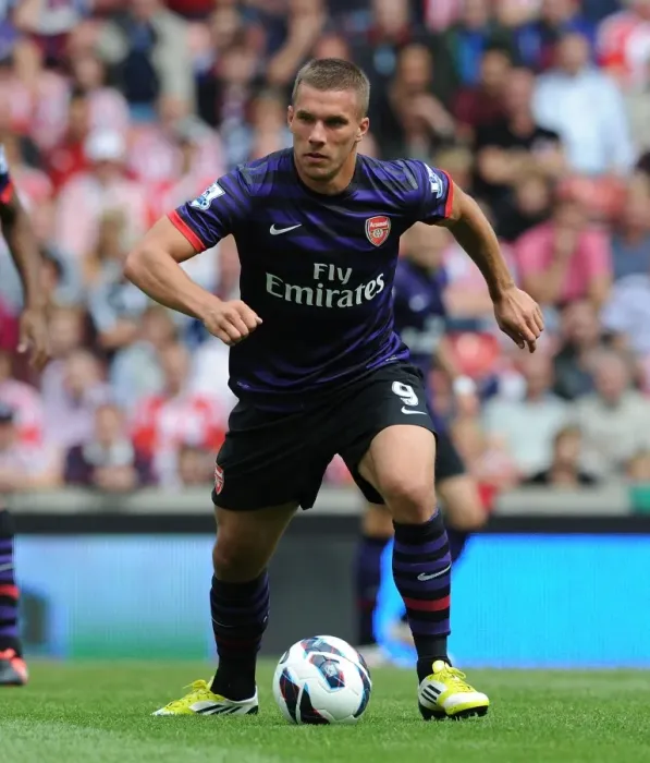 Framed Print : Podolski in Action: Arsenal vs. Stoke City, Premier League 2012-13