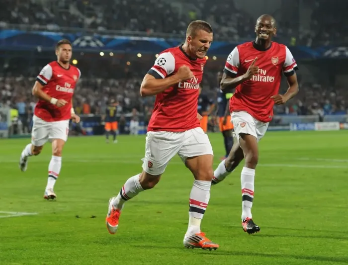 Framed Print : Podolski and Diaby Celebrate Arsenal's First Goal vs Montpellier (2012-13 Champions League)