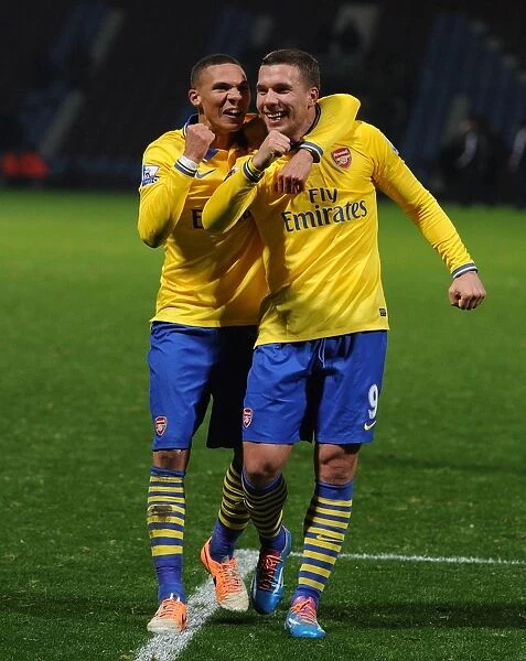Podolski and Gibbs Celebrate Arsenal's Win over West Ham United