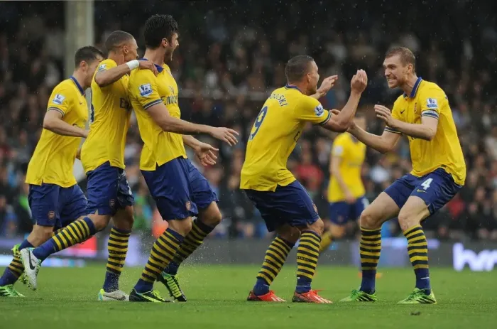 Framed Print : Podolski and Mertesacker Celebrate Arsenal's Second Goal Against Fulham (2013-14)