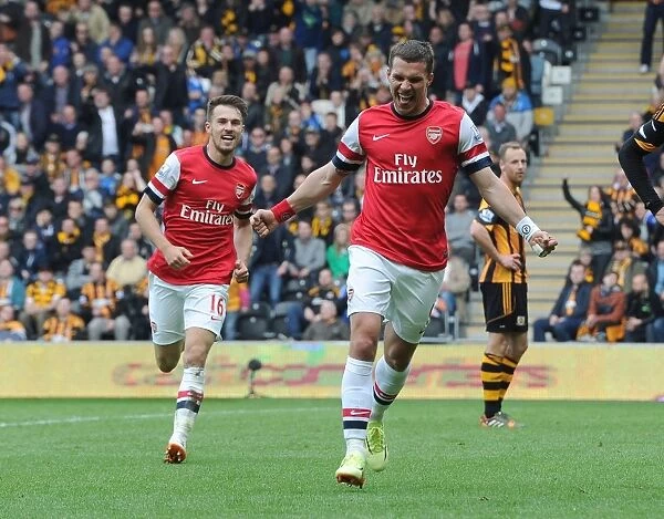 Podolski and Ramsey's Unforgettable Moment: Arsenal's Winning Goals Against Hull City (2014)