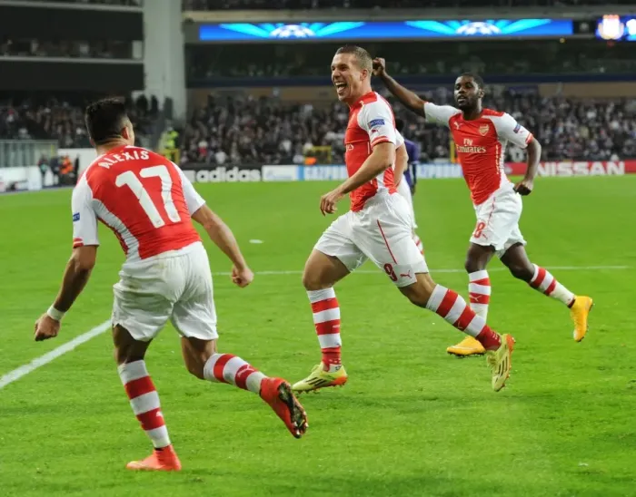 Framed Print : Podolski Scores Arsenal's Second Goal in Champions League Clash against RSC Anderlecht
