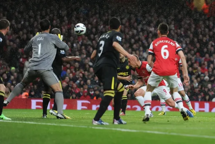 Framed Print : Podolski Scores First: Arsenal vs. Wigan Athletic, Premier League 2012-13