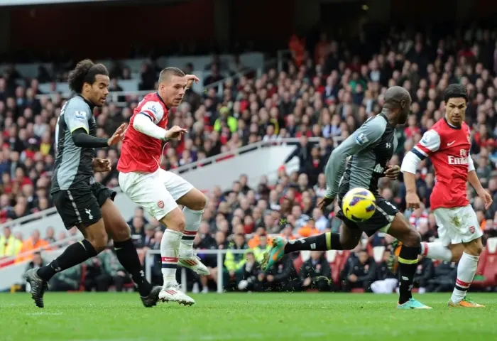 Framed Print : Podolski Scores Past Gallas: Arsenal's Thrilling Victory Over Tottenham in the Premier League 2012-13