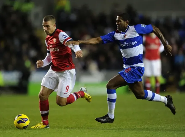 Framed Print : Podolski vs. Leigertwood: Battle at the Madejski Stadium - Reading v Arsenal, Premier League 2012-13