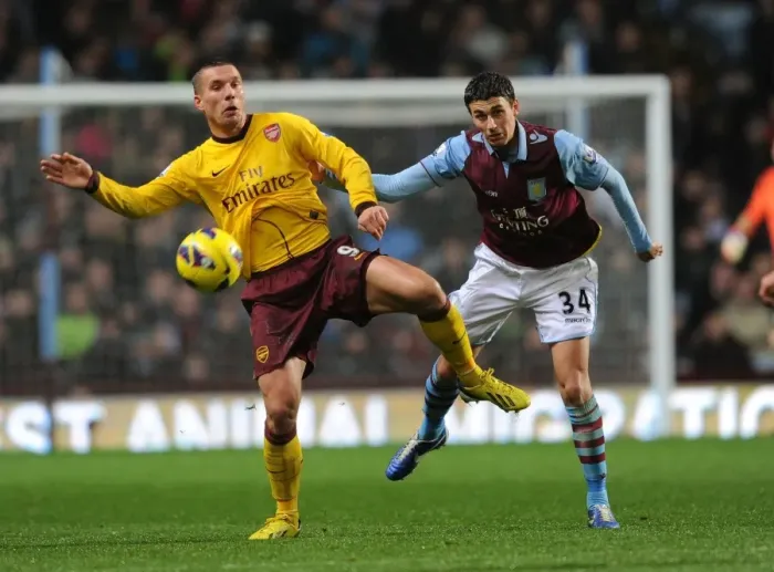 Framed Print : Podolski vs. Lowton: A Battle at Villa Park - Arsenal vs. Aston Villa, Premier League 2012-13 Framed Print : Podolski vs. Lowton: A Battle at Villa Park - Arsenal vs. Aston Villa, Premier League 2012-13