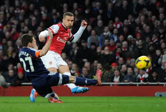 Framed Print : Podolski vs. Riether: Intense Moment at Arsenal v Fulham, Premier League Framed Print : Podolski vs. Riether: Intense Moment at Arsenal v Fulham, Premier League