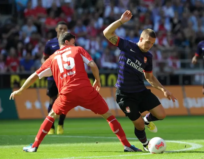 Framed Print : Podolski's Homecoming: Arsenal Thrash Cologne 4-0 in Pre-Season Friendly