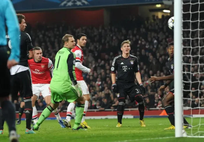 Framed Print : Podolski's Stunning Header: Arsenal's Shocking Upset Against Neuer and Alaba in the Champions League, 2012-13
