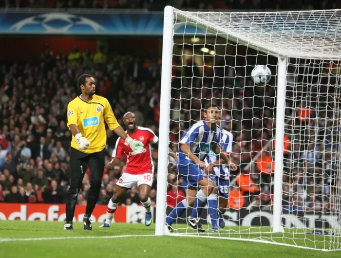Framed Print : Porto goalkeeper Helton looks on as Emmanuel Adebayor s Framed Print : Porto goalkeeper Helton looks on as Emmanuel Adebayor s