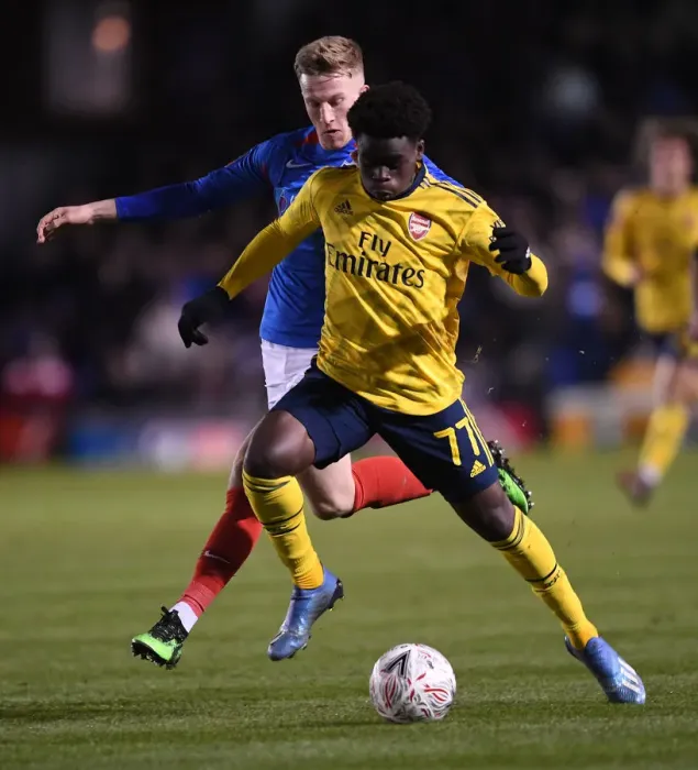 Framed Print : Portsmouth vs Arsenal: FA Cup Fifth Round Clash - Bukayo Saka Faces Off Against Ross McCrorie