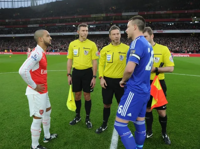 Framed Print : Premier League Rivalry: Arsenal vs. Chelsea - Walcott and Terry Lead the Charge at Emirates Stadium