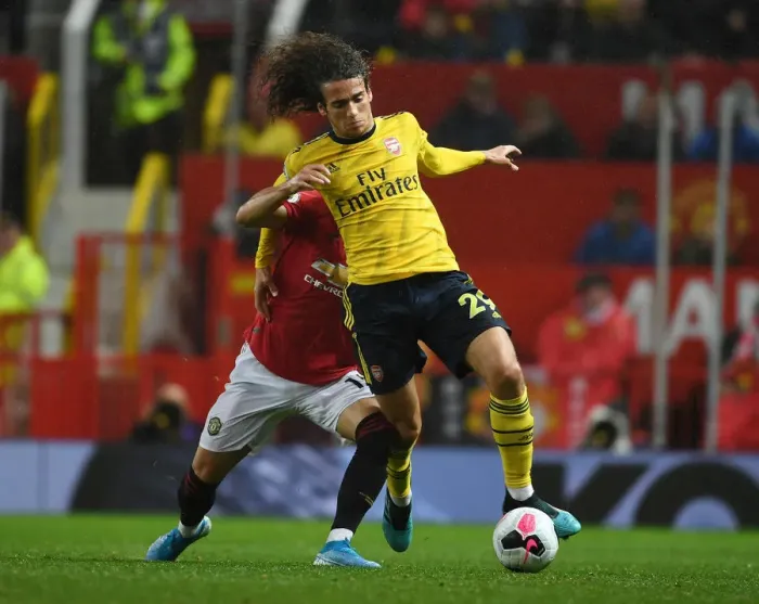Framed Print : Premier League Showdown: Manchester United vs. Arsenal (2019-20) - Clash at Old Trafford: A Battle of Wits and Skills