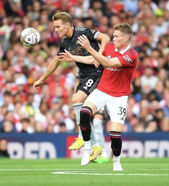 Premier League Showdown: Manchester United vs. Arsenal (2022-23) - A Battle of Wits and Skills: Martin Odegaard vs. Scott McTominay at Old Trafford