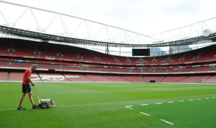 Framed Print : Preparing for the Arsenal-Liverpool Battle: Marking the Emirates Stadium Pitch for Premier League Clash, 2016-17