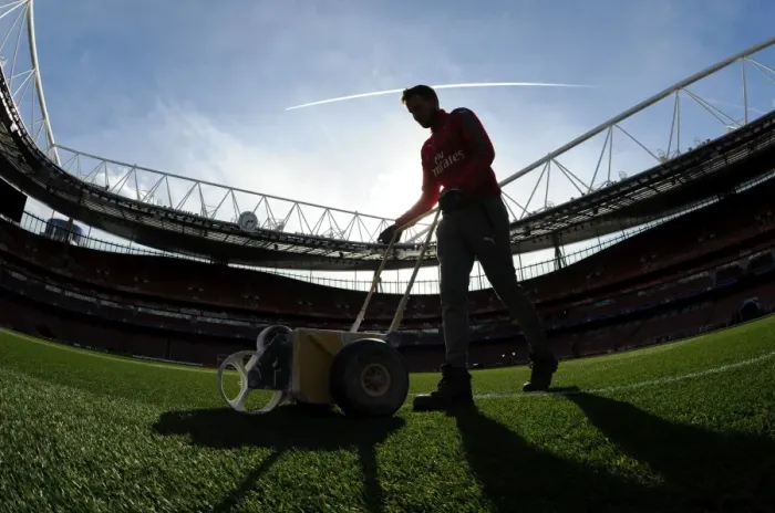 Framed Print : Preparing the Emirates Turf: Arsenal FC vs. FC Bayern Munich - UEFA Champions League Showdown