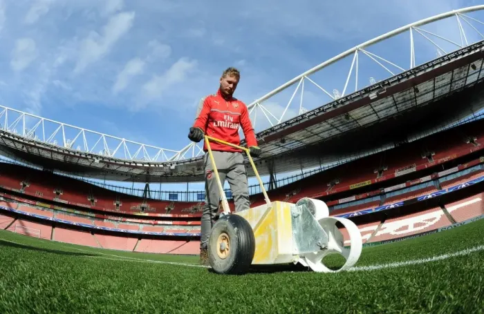 Framed Print : Preparing the Emirates Turf: Arsenal FC vs. FC Bayern Munich - UEFA Champions League Showdown