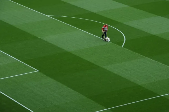 Framed Print : Preparing the Emirates Turf: Arsenal's Groundsmen Mark Out the Pitch for Arsenal vs. Sunderland (2015)
