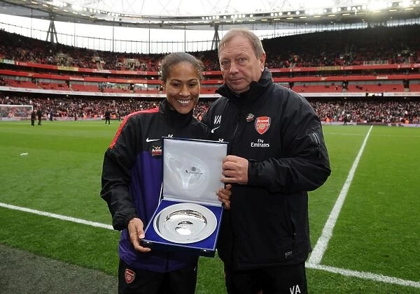 Rachel Yankey (Arsenal Ladies) presented with a token of reaching Englands record caps by Vic Akers