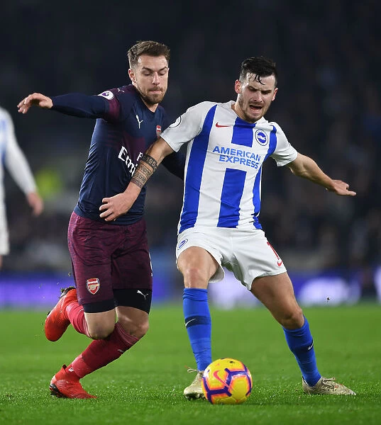 Ramsey Closes In: Intense Battle Between Aaron Ramsey and Pascal Gross in the Premier League Clash Between Brighton & Hove Albion and Arsenal FC
