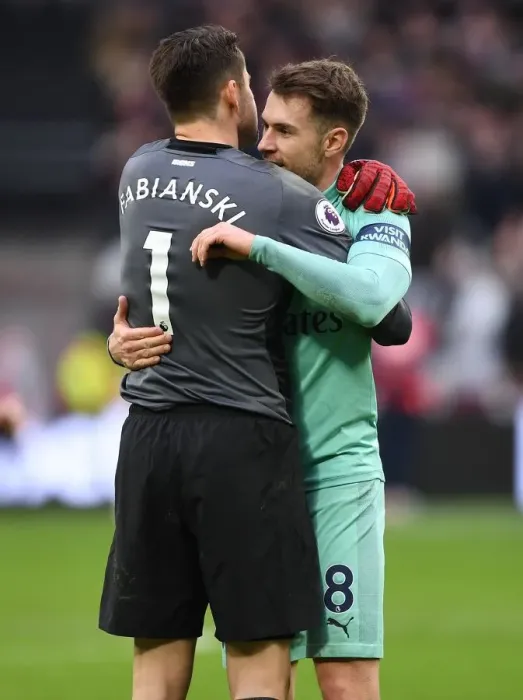 Framed Print : Ramsey and Fabianski Reunite: A Heartfelt Embrace at West Ham vs Arsenal, Premier League 2018-19