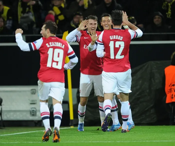 Framed Print : Ramsey, Ozil, and Giroud's Goal Celebration: Borussia Dortmund vs. Arsenal, UEFA Champions League (2013-14) Framed Print : Ramsey, Ozil, and Giroud's Goal Celebration: Borussia Dortmund vs. Arsenal, UEFA Champions League (2013-14)
