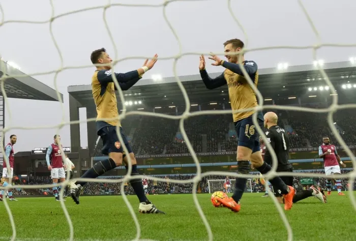 Framed Print : Ramsey and Ozil's Jubilant Moment: Arsenal's Victory over Aston Villa, Premier League 2015-16