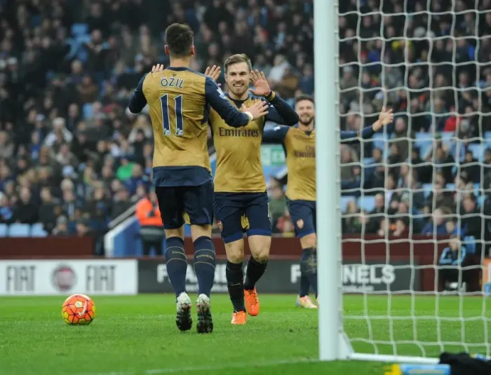Framed Print : Ramsey and Ozil's Unforgettable Goal Celebration: Arsenal's Victory Against Aston Villa (2015-16)