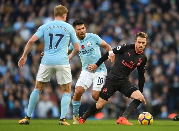 Ramsey Under Pressure: Sergio Aguero and Kevin De Bruyne Harass Arsenal Midfielder during Manchester City vs Arsenal Premier League Clash