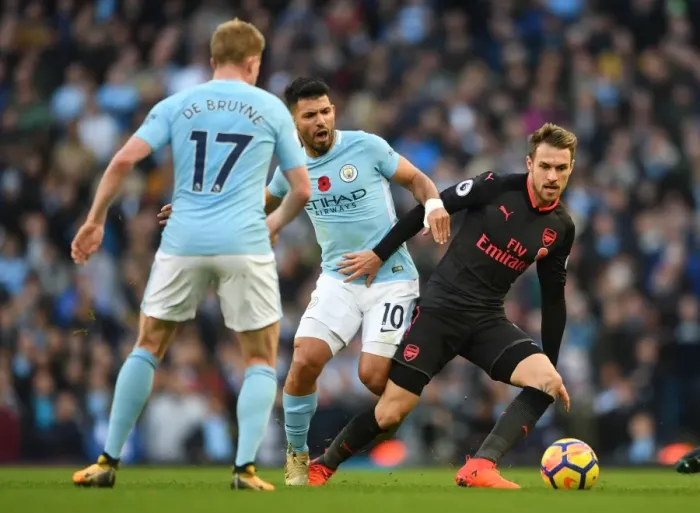 Framed Print : Ramsey Under Pressure: Sergio Aguero and Kevin De Bruyne Harass Arsenal Midfielder during Manchester City vs Arsenal Premier League Clash