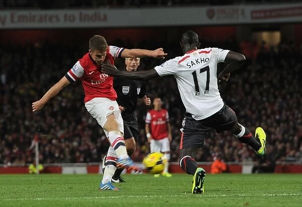 Ramsey Strikes Again: Arsenal's Number 8 Scores Dramatic Goal Past Sakho in Arsenal v Liverpool Clash (2013-14)