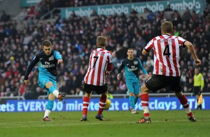 Framed Print : Ramsey Strikes: Arsenal Takes the Lead over Sunderland in Premier League Clash