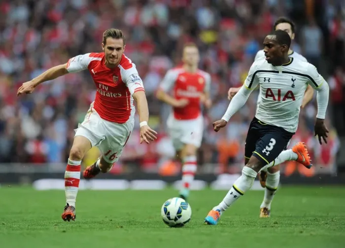 Framed Print : Ramsey Surges Past Rose: Intense Moment from the Arsenal v Tottenham Rivalry Framed Print : Ramsey Surges Past Rose: Intense Moment from the Arsenal v Tottenham Rivalry