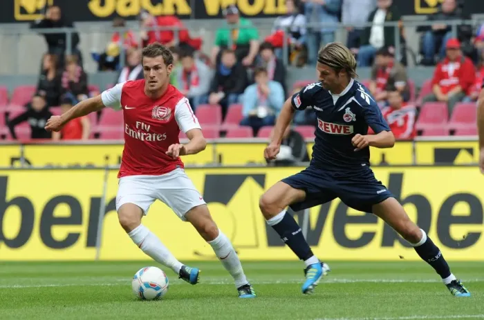 Framed Print : Ramsey Takes on Lanig: Cologne vs Arsenal Pre-Season Clash
