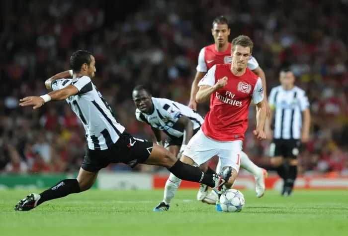 Framed Print : Ramsey vs. Benatia: A Champion's Battle in Arsenal's 2011 Champions League Showdown Framed Print : Ramsey vs. Benatia: A Champion's Battle in Arsenal's 2011 Champions League Showdown