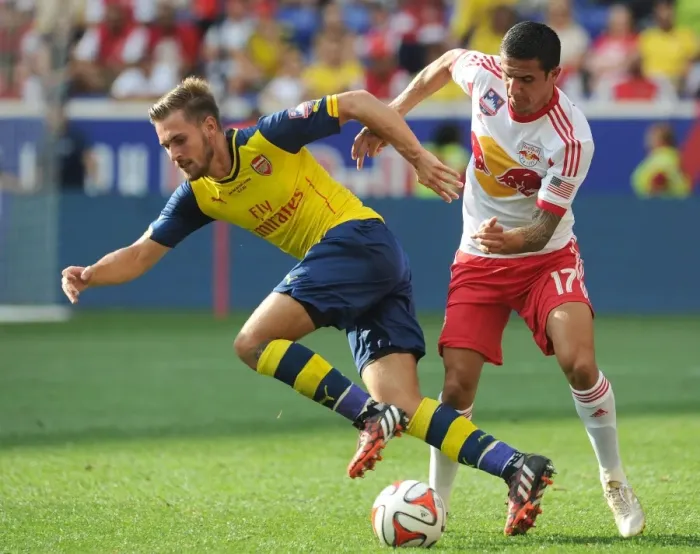 Framed Print : Ramsey vs. Cahill: Clash in Pre-Season Friendly between New York Red Bulls and Arsenal
