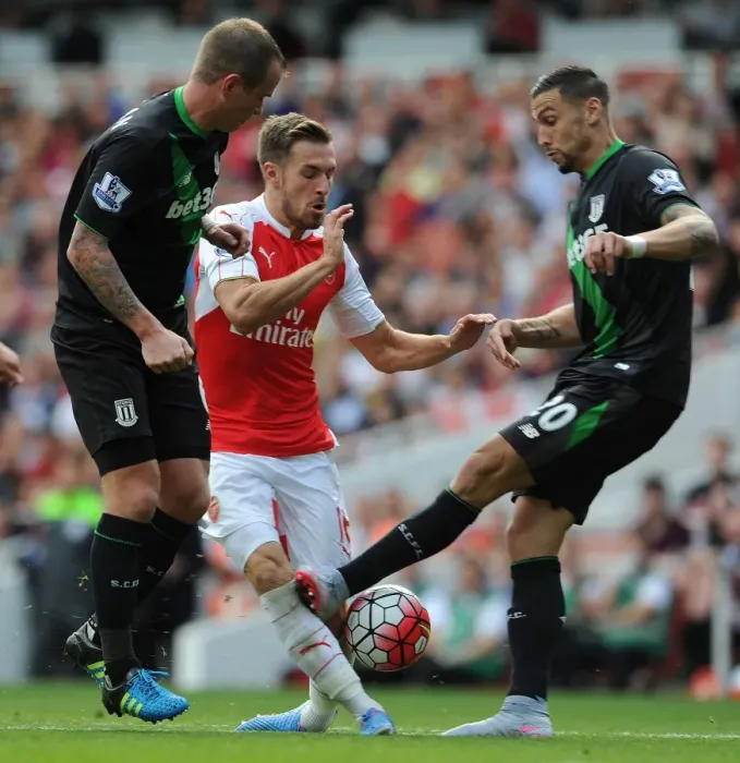 Framed Print : Ramsey vs. Cameron: Intense Face-Off in Arsenal's Clash Against Stoke City Framed Print : Ramsey vs. Cameron: Intense Face-Off in Arsenal's Clash Against Stoke City