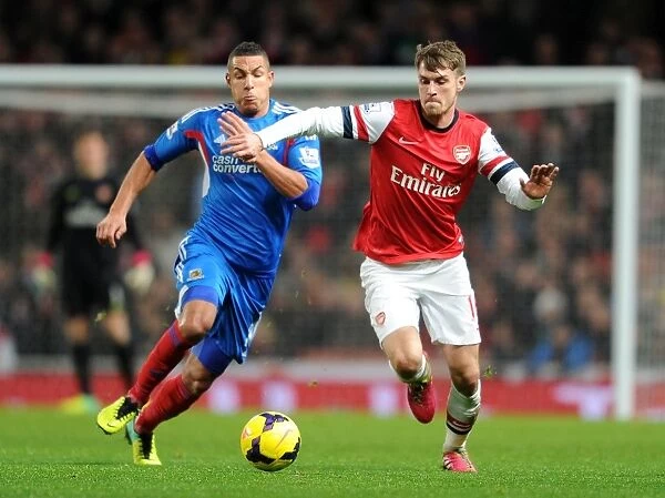 Ramsey vs. Livermore: A Battle of Intense Determination in Arsenal's Clash Against Hull (2013-14)