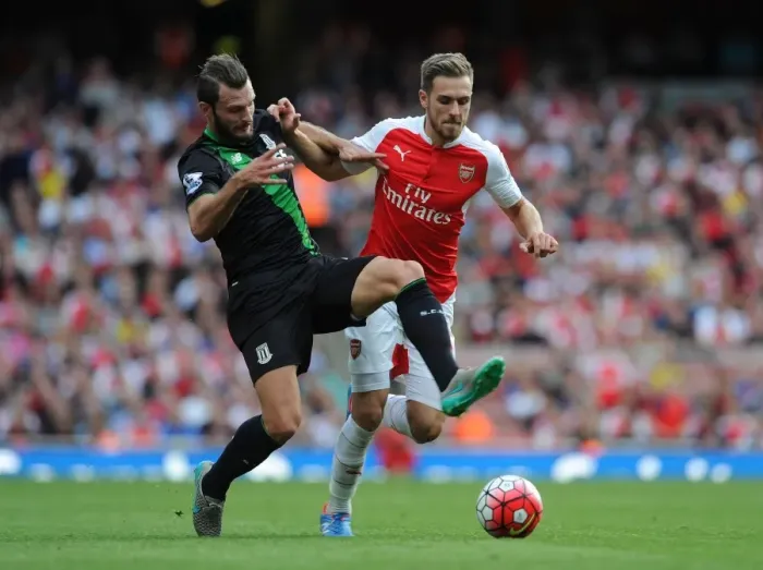 Framed Print : Ramsey vs Pieters: Intense Face-Off in Arsenal vs Stoke Premier League Clash