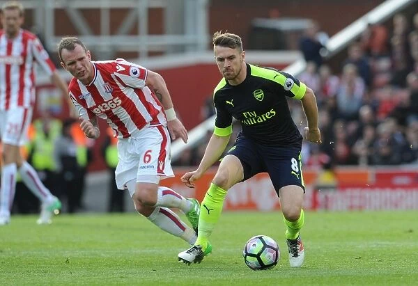 Ramsey vs. Whelan: Intense Battle in Stoke City vs. Arsenal Premier League Clash