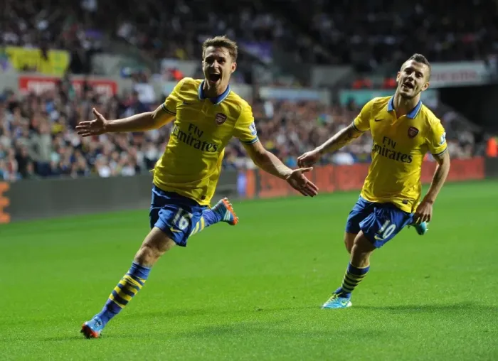 Framed Print : Ramsey and Wilshere: Celebrating Arsenal's Winning Goals Against Swansea (2013-14)