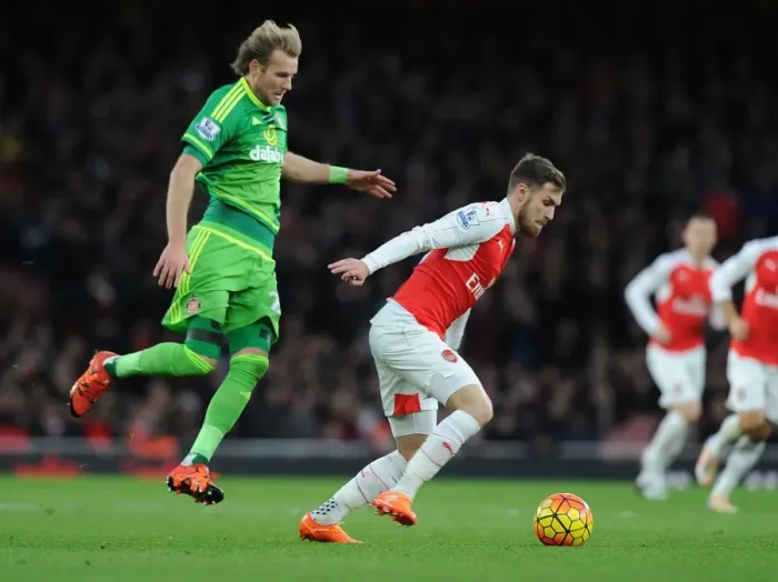 Framed Print : Ramsey's Agile Moves: Outmaneuvering Toivonen in Arsenal's Premier League Victory Framed Print : Ramsey's Agile Moves: Outmaneuvering Toivonen in Arsenal's Premier League Victory