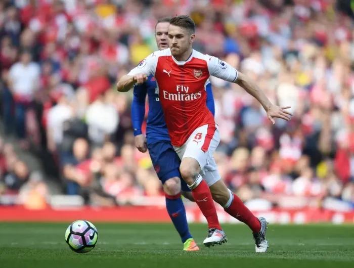 Framed Print : Ramsey's Brilliant Outmaneuver: Arsenal's Star Outsmarts Rooney in Thrilling Premier League Clash (2016-17)