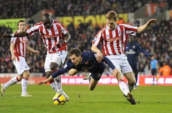 Ramsey's Brilliant Performance: Arsenal Overpower Stoke's Shawcross and Faye (3-1)